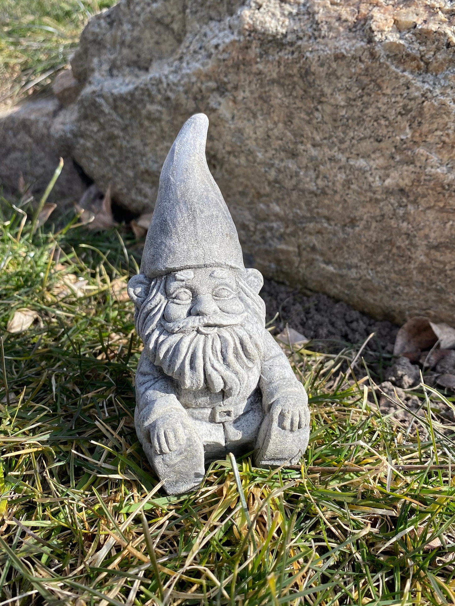 Handmade cement gnome pair for garden decor, featuring unique expressions and crafted with care in Idaho, USA.